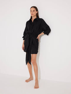 Front View: Model in Guadalupe Black Dress - MOEVA Luxury Swimwear, Button Fastening Through Front, Layered With Panel, Tie At The Front, Linen Fabric,  MOEVA Luxury Swimwear