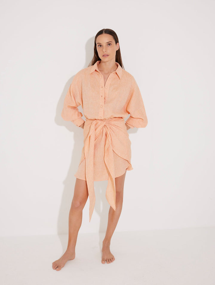 Front View: Model in Guadalupe Orange Dress - MOEVA Luxury Swimwear, Button Fastening Through Front, Layered With Panel, Tie At The Front, Linen Fabric,  MOEVA Luxury Swimwear