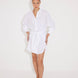 "Front view of a model in the Guadalupe White Dress, showcasing its cinched waist and elegant silhouette."