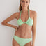 "Model wearing the Gunnel Mint Green Bikini Top from the front, showcasing the U-Front neckline and ABS chain straps."