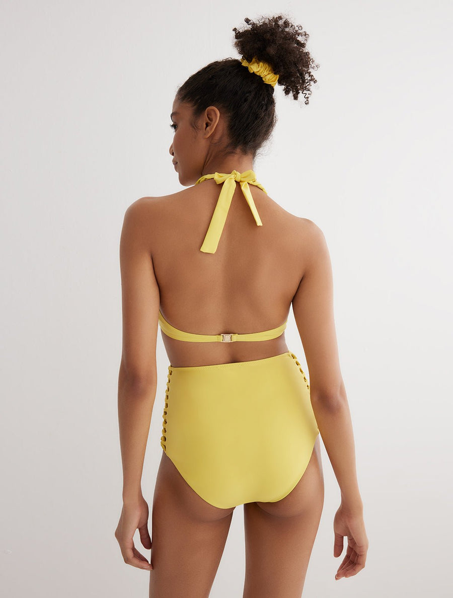Back View: Model in Gunnel Yellow Bikini Top - MOEVA Luxury Swimwear, Back Claps Closure, Ruched Detail Throughout, French & Italian Fabric, Special Lycra Xtralife Certificate, MOEVA Luxury Swimwear