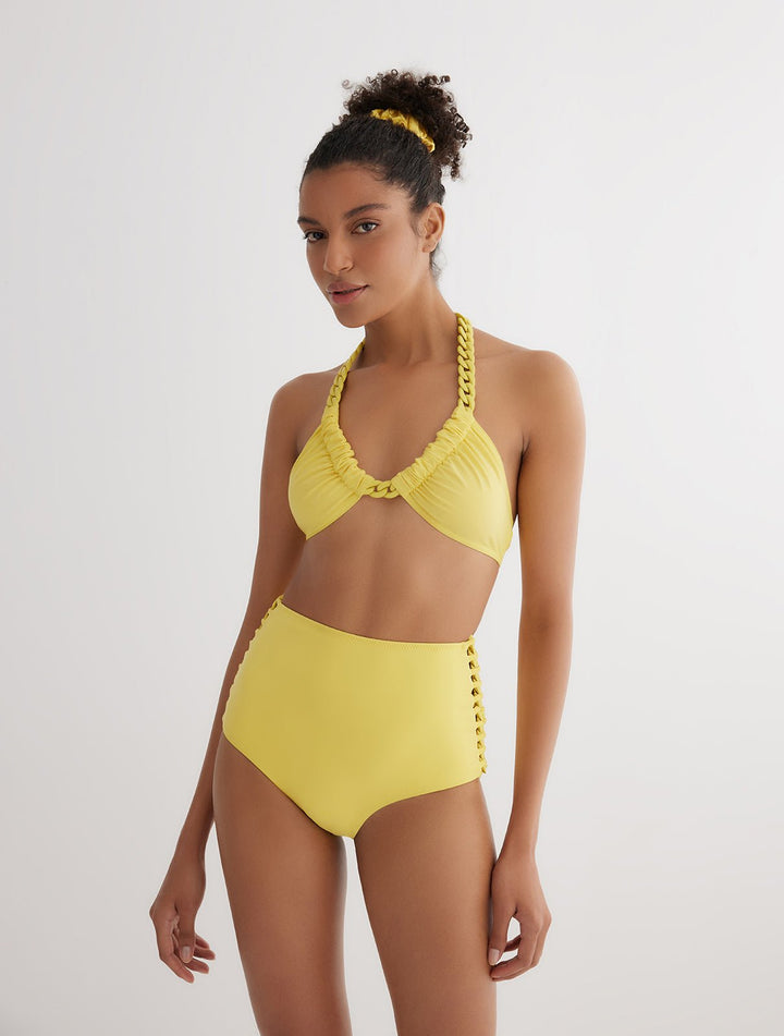 Front View: Model in Gunnel Yellow Bikini Top - MOEVA Luxury Swimwear, Fully Lined, U-Front Neckline, ABS Chain Straps, MOEVA Luxury Swimwear