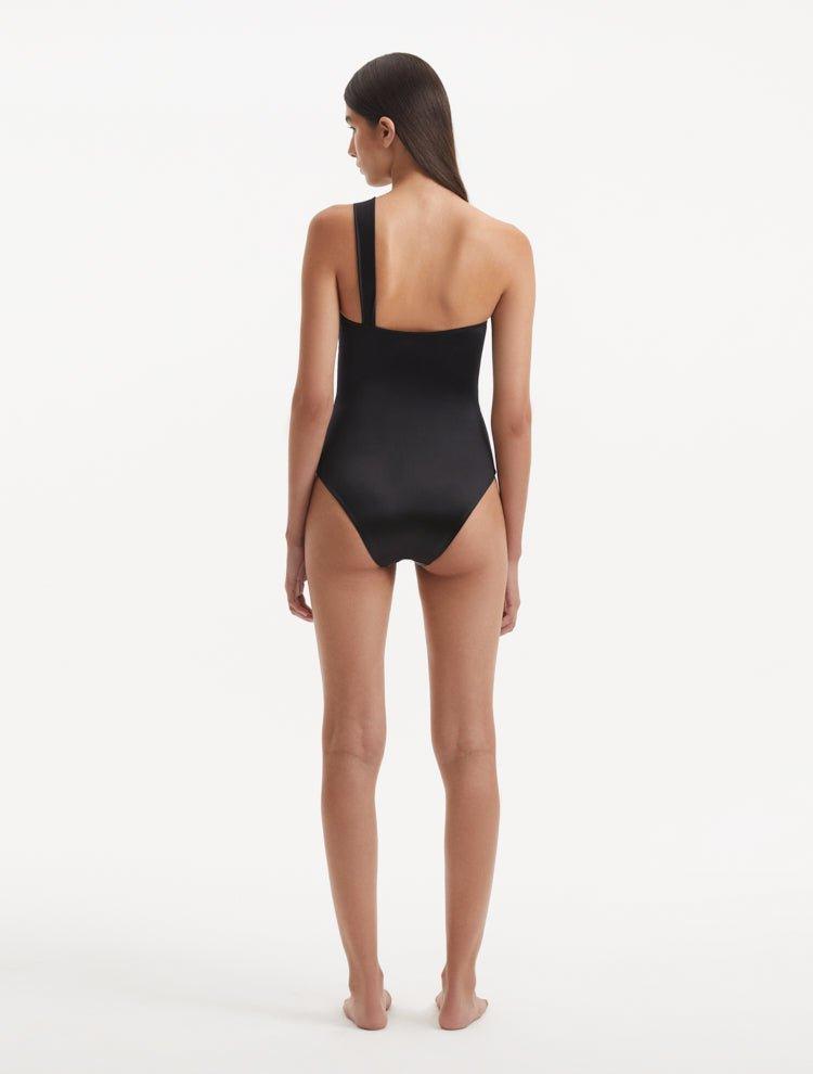  Back view of the Halin Black Swimsuit, emphasizing the high waist and moderate bottom coverage.