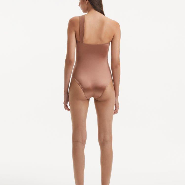 Halin Brown One Shoulder Satin Swimsuit | Moeva | Swimsuit | Each week unveils new pieces—luxury swimwear, fluid resort silhouettes, and elevated summer-to-evening essentials designed to carry you from coastal escapes to city nights.