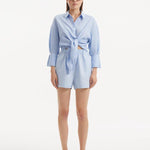 " Masha Baby Blue Shorts from the front, showcasing the high-waisted silhouette, relaxed fit, and mid-thigh length. "