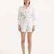 "Model wearing the Masha White Shorts from the front, displaying the high-waisted design and relaxed fit."