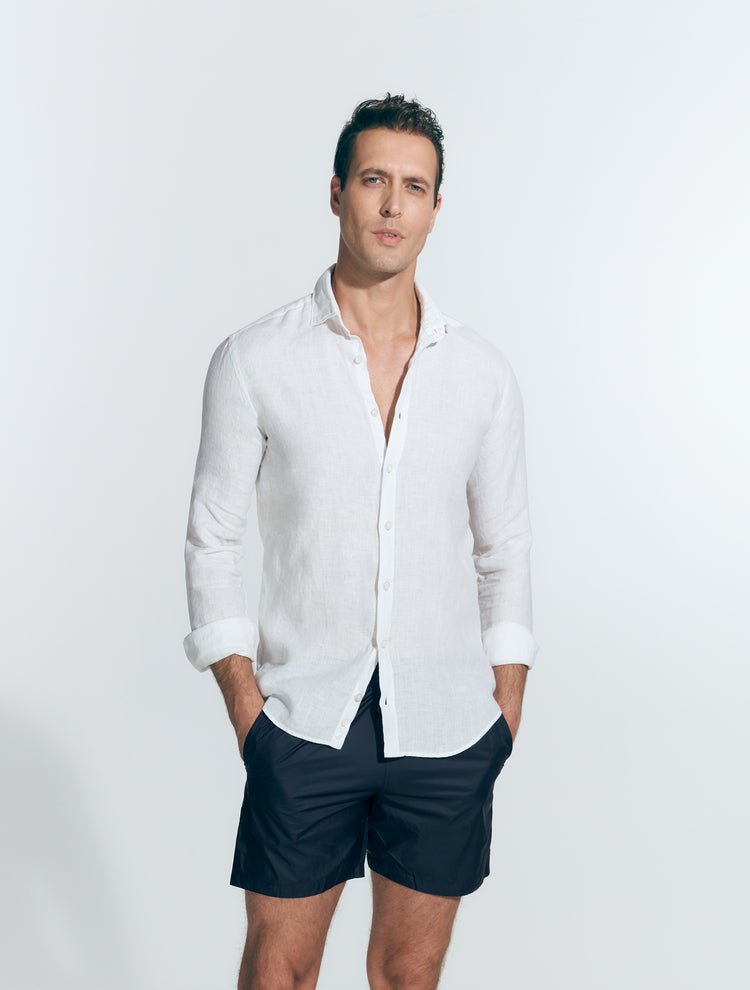 Front View: Model in Harry White  Shirt - MOEVA Luxury Swimwear, Spread Collar, Buttoned Cuffs, Button Fastening, Long-Sleeved, Slim Fit, MOEVA Luxury Swimwear