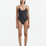 Front View: Model in Hartley Silver Swimsuit - MOEVA Luxury Swimwear, Scoop Neck, Ribbed, Button Detailed, Adjustable Straps, Knitted Scoop Neck Swimsuit, MOEVA Luxury Swimwear 