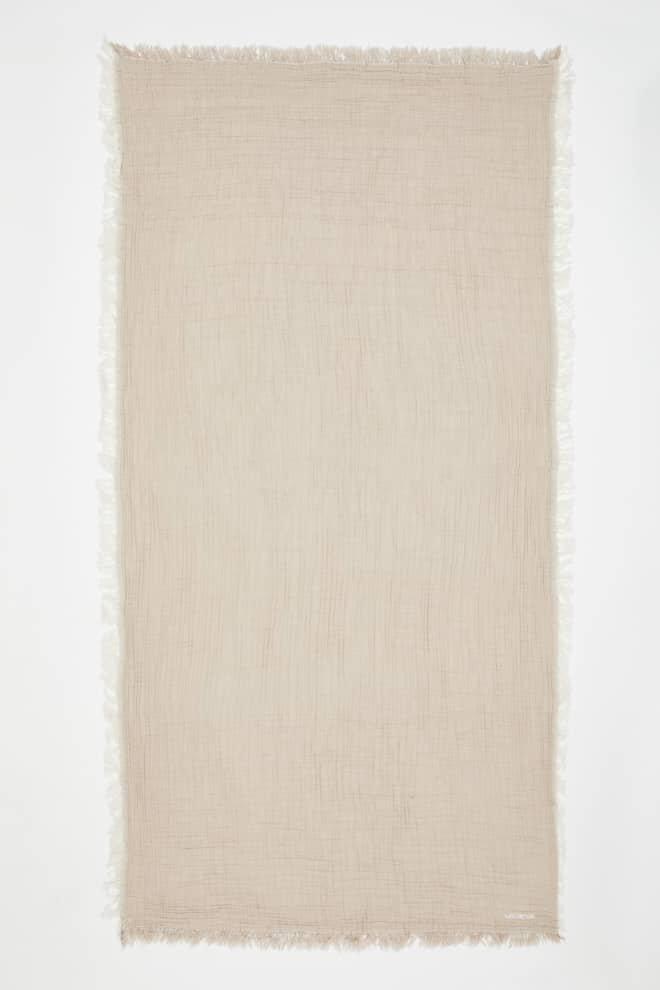Front View of Ibiza Beige/Ecru Towel - MOEVA Luxury  Swimwear, Organic Turkish Cotton, Soft & Smooth, Full Reversible, Dainty Fringes, Quick Drying, Embroidered Moeva logo, Length: 160 cm / Width: 80 cm, %100 Cotton, MOEVA Luxury  Swimwear     