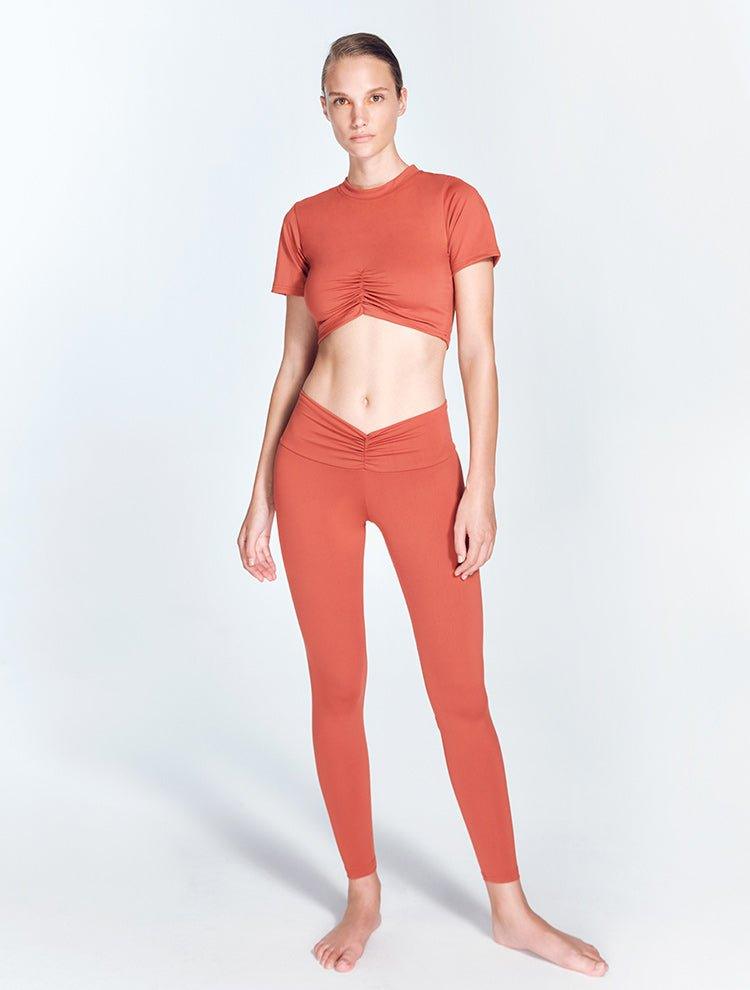 Ida Red Ochre Leggings | Moeva | Activewear | Each week unveils new pieces—luxury swimwear, fluid resort silhouettes, and elevated summer-to-evening essentials designed to carry you from coastal escapes to city nights.
