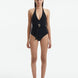 Front View of Model Wearing Imelda Black Swimsuit - MOEVA Luxury Swimwear, Halter Neck, Tie Neck, V Neckline, Draped Front Piece Detail, Removable Padding One Piece Women's Swimwear, Twisted Gold Accessory, MOEVA Luxury Swimwear   