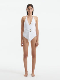 Front View of Model Wearing Imelda Imelda White Swimsuit - MOEVA Luxury Swimwear, Halter Neck, Tie Neck, V Neckline, Draped Front Piece Detail, Removable Padding One Piece Women's Swimwear, Twisted Gold Accessory, MOEVA Luxury Swimwear   