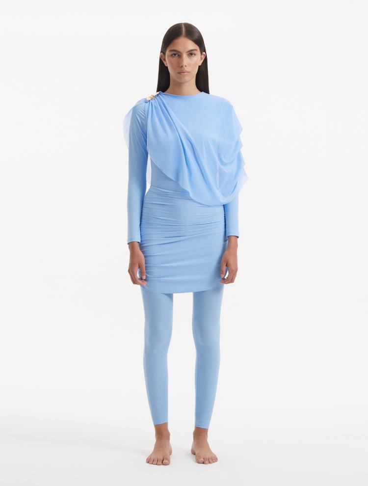 Introducing the Ishtar Baby Blue Burkini – a sublime fusion of traditional modesty and modern design sensibilities. Crafted for the woman who cherishes her cultural heritage but also appreciates the conveniences of contemporary design, this burkini exudes an air of serene elegance, offering both style and functionality.   Hues and Design Featuring an easy pull-over design, the Ishtar Burkini promises a smooth dressing experience, allowing for swift transitions from tranquil shores to refreshing waters. Its 