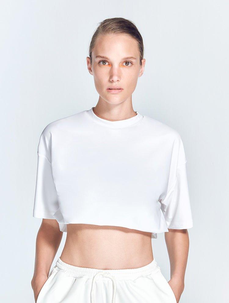 Isolde White Top | Moeva | Activewear | Each week unveils new pieces—luxury swimwear, fluid resort silhouettes, and elevated summer-to-evening essentials designed to carry you from coastal escapes to city nights.