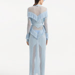 "Back view of the Itzel baby blue kaftan, demonstrating its full-length, soft folds, and the elegant drape of the fabric, capturing the serene beauty of the design."