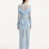 "Back view of the Itzel baby blue kaftan, demonstrating its full-length, soft folds, and the elegant drape of the fabric, capturing the serene beauty of the design."