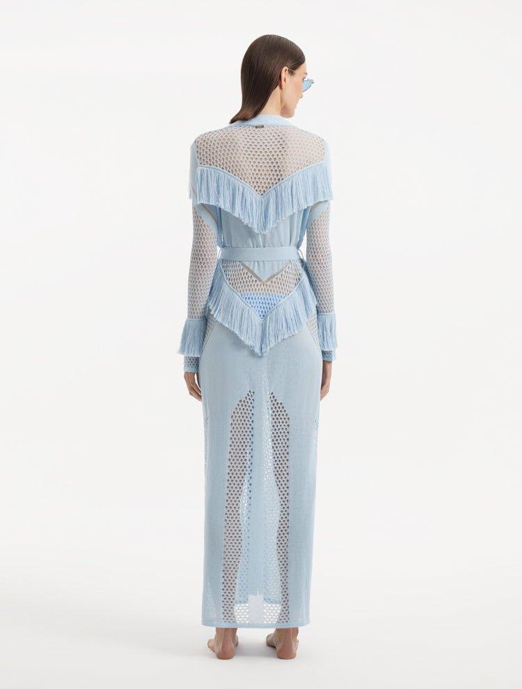 "Back view of the Itzel baby blue kaftan, demonstrating its full-length, soft folds, and the elegant drape of the fabric, capturing the serene beauty of the design."