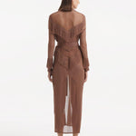 "Side view of the Itzel brown kaftan, highlighting its flowing, ankle-length silhouette, playful fringes, and versatile self-tie belt, capturing the relaxed and stylish fit."