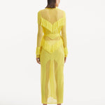"Back view of the Itzel yellow kaftan, showing the full-length, flowing design and soft fabric, illustrating its relaxed yet glamorous style."