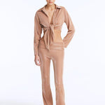 Izara Bronze Mid-Rise Flared Pants | Moeva | Women Beachwear Pants | Each week unveils new pieces—luxury swimwear, fluid resort silhouettes, and elevated summer-to-evening essentials designed to carry you from coastal escapes to city nights.