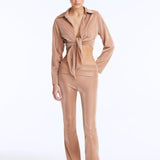 Izara Bronze Mid-Rise Flared Pants | Moeva | Women Beachwear Pants | Each week unveils new pieces—luxury swimwear, fluid resort silhouettes, and elevated summer-to-evening essentials designed to carry you from coastal escapes to city nights.