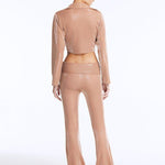 Izara Bronze Mid-Rise Flared Pants | Moeva | Women Beachwear Pants | Each week unveils new pieces—luxury swimwear, fluid resort silhouettes, and elevated summer-to-evening essentials designed to carry you from coastal escapes to city nights.