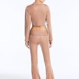 Izara Bronze Mid-Rise Flared Pants | Moeva | Women Beachwear Pants | Each week unveils new pieces—luxury swimwear, fluid resort silhouettes, and elevated summer-to-evening essentials designed to carry you from coastal escapes to city nights.