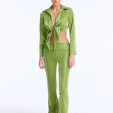 Izara Green Mid-Rise Flared Pants | Moeva | Women Beachwear Pants | Each week unveils new pieces—luxury swimwear, fluid resort silhouettes, and elevated summer-to-evening essentials designed to carry you from coastal escapes to city nights.