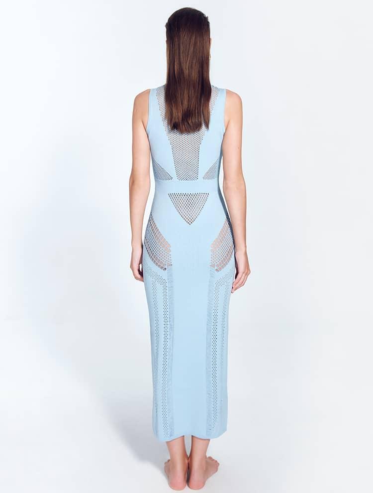 "Back view of the Izzy Baby Blue Dress highlighting its ankle-length silhouette, sleeveless top, and semi-sheer knit fabric with intricate stripe details."