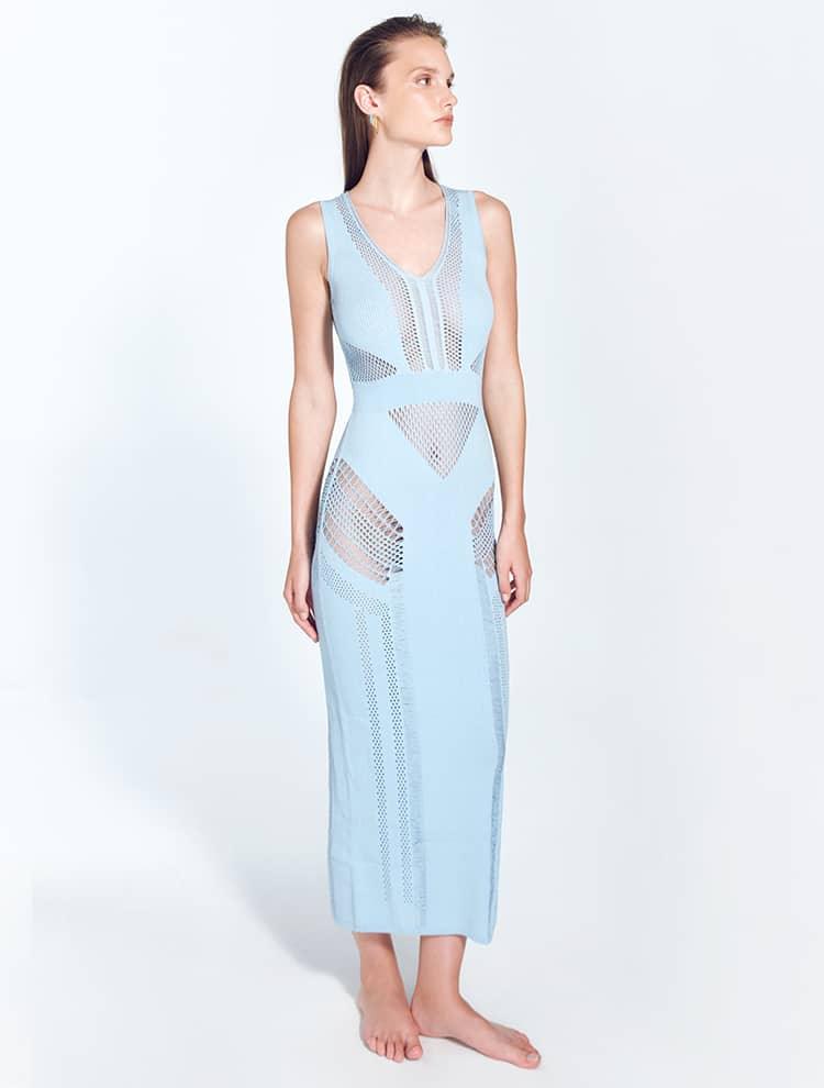 "Front view of the Izzy Baby Blue Dress showing its elegant ankle-length cut, sleeveless design, and V-neckline, with detailed semi-sheer knit patterns and stripes."