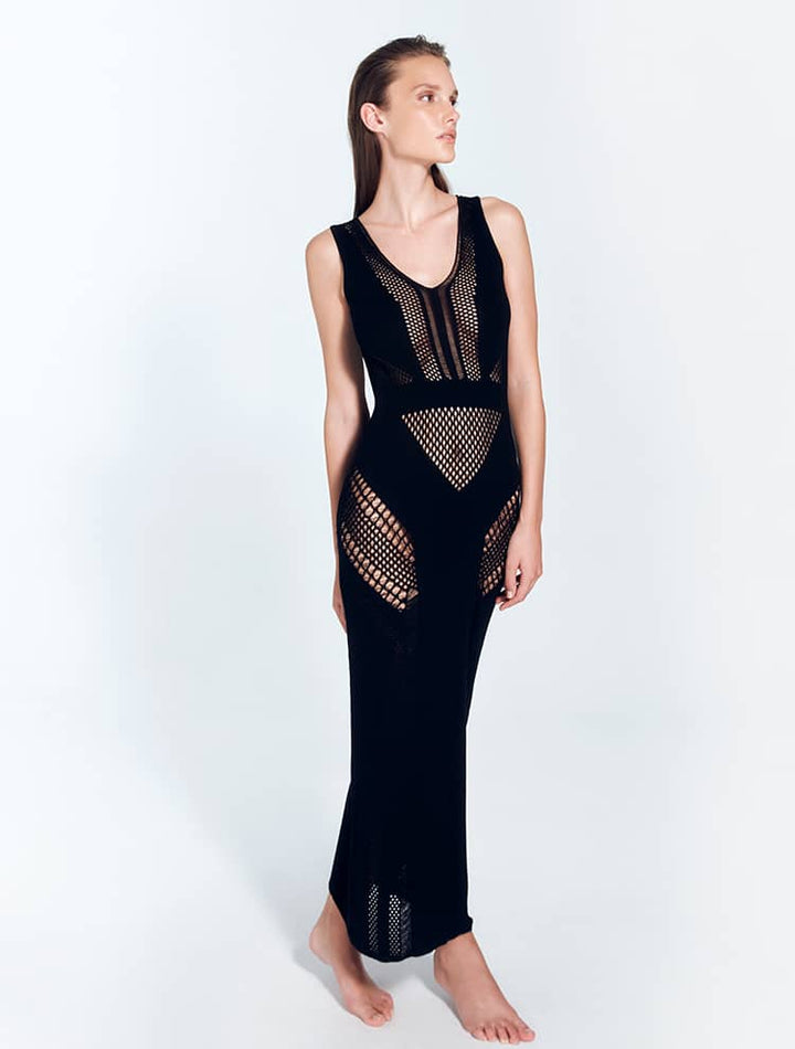 Front View: Model in Izzy Black Dress - MOEVA Luxury Swimwear, Knitted Dress, V Neckline, Ankle Length, MOEVA Luxury Swimwear