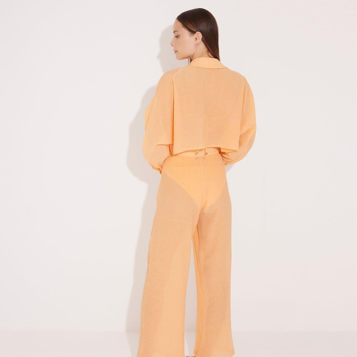 Jacinta Orange Cropped Sheer Long Sleeve Shirt and Aura Orange High Waist Beach Pants | Moeva | Shirt and Pants | Each week unveils new pieces—luxury swimwear, fluid resort silhouettes, and elevated summer-to-evening essentials designed to carry you from coastal escapes to city nights.
