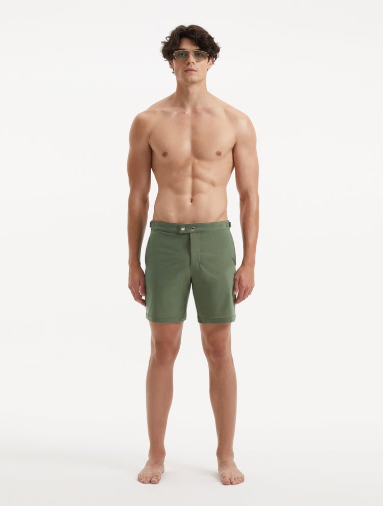 "Front view of Jack army green swim shorts with side fasteners and buttoned back pockets"