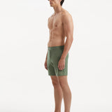 "Side view of Jack army green swim shorts highlighting the mid-thigh length and tailored design"