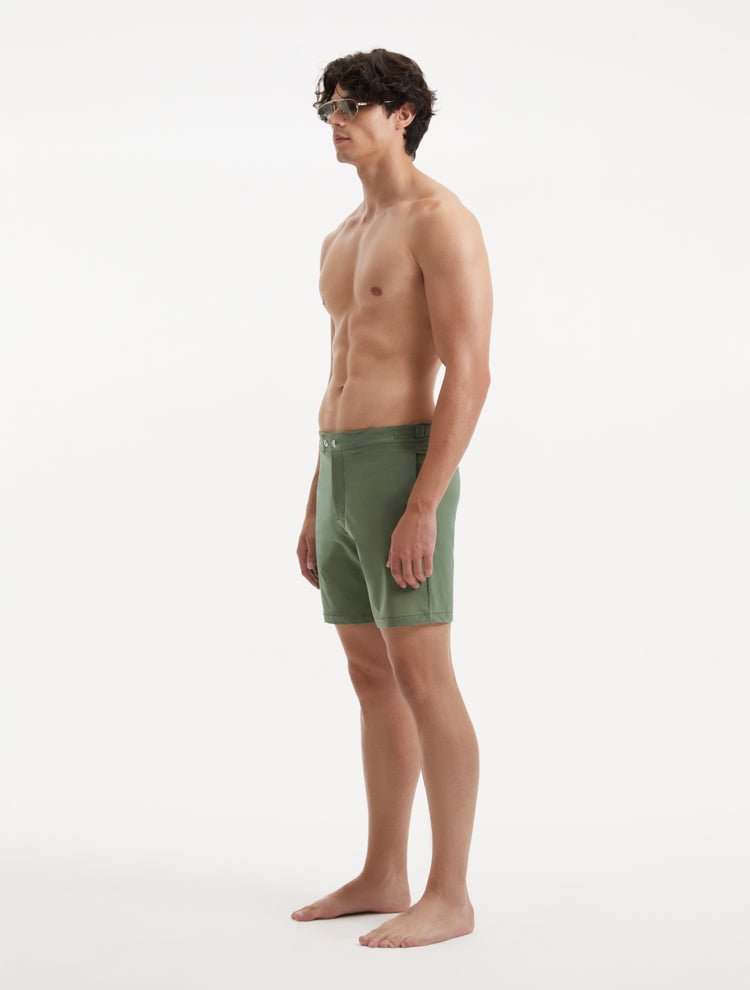 "Side view of Jack army green swim shorts highlighting the mid-thigh length and tailored design"
