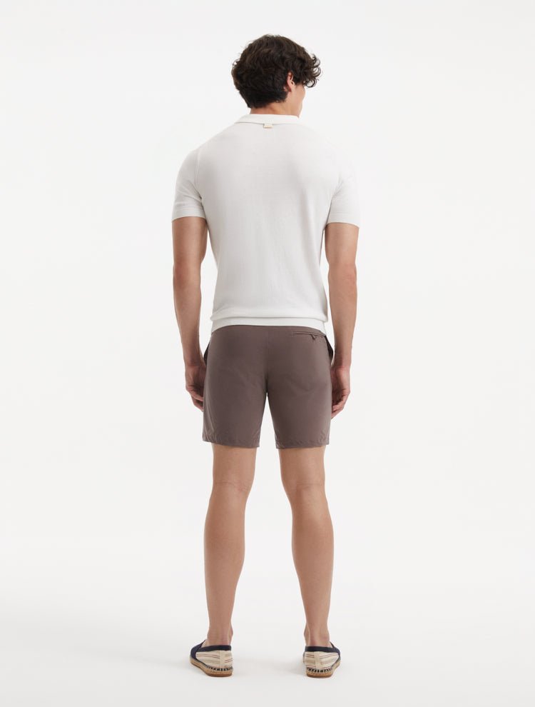 "Back view of Jack brown swim shorts on a model, emphasizing the clean lines and stylish cut"