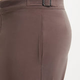 "Close-up of Jack brown swim shorts showing the buttoned back pockets and snap-zip fastening"