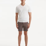 "Front view of a model wearing Jack brown swim shorts, showcasing the modern slim fit and quick-dry fabric"