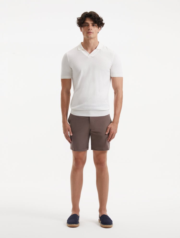 "Front view of a model wearing Jack brown swim shorts, showcasing the modern slim fit and quick-dry fabric"