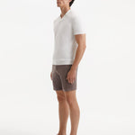 "Side view of Jack brown swim shorts with front slash pockets and stylish buckles"