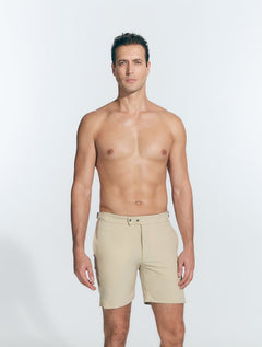 Front View: Model in Jack Khaki Shorts - MOEVA Luxury Swimwear, Slim Fitting, Lightweight Fabric with Quick Drying, Front Slash Pockets, Snap and Zip Fastening, Buckles at the Waist, Quick Dry, MOEVA Luxury Swimwear