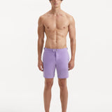 "Front view of Jack lilac swim shorts highlighting the slim fit, snap and zip fastening, and stylish buckles"