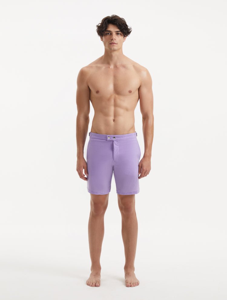 "Front view of Jack lilac swim shorts highlighting the slim fit, snap and zip fastening, and stylish buckles"