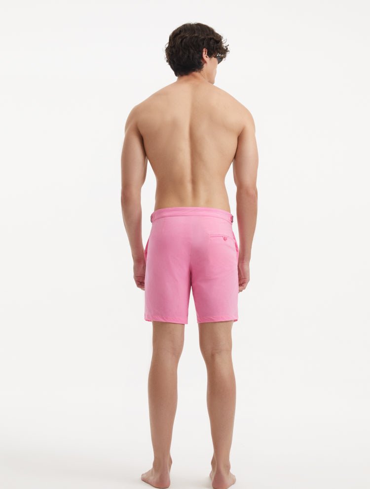 Back View: Model in Jack Pink Shorts - MOEVA Luxury Swimwear, Nikel, Mid Length Swim Shorts, Fully Lined, Slim Fit, Strech Classic,  Buttoned Back Pockets, MOEVA Luxury Swimwear