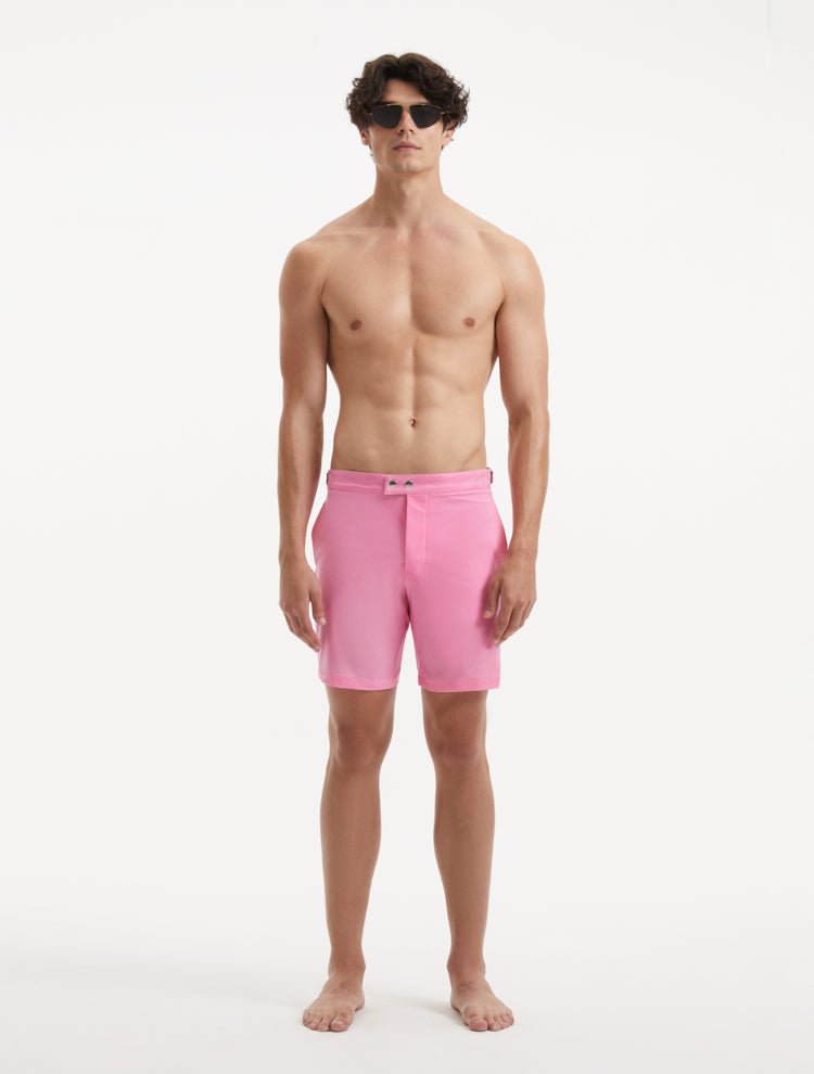 Front View: Model in Jack Pink Shorts - MOEVA Luxury Swimwear, Slim Fitting, Lightweight Fabric with Quick Drying, Front Slash Pockets, Snap and Zip Fastening, Buckles at the Waist, Quick Dry, MOEVA Luxury Swimwear