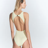 "Model wearing the Jackie Yellow Swimsuit from the back, highlighting the open back design and gold-plated clasp closure."