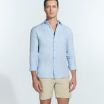 Front View: Model in James Baby Blue Shirt - MOEVA Luxury Swimwear, Spread Collar, Buttoned Cuffs, Button Fastening, Long-Sleeved, Slim Fit, MOEVA Luxury Swimwear