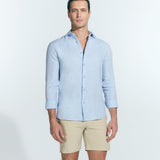 Front View: Model in James Baby Blue Shirt - MOEVA Luxury Swimwear, Spread Collar, Buttoned Cuffs, Button Fastening, Long-Sleeved, Slim Fit, MOEVA Luxury Swimwear