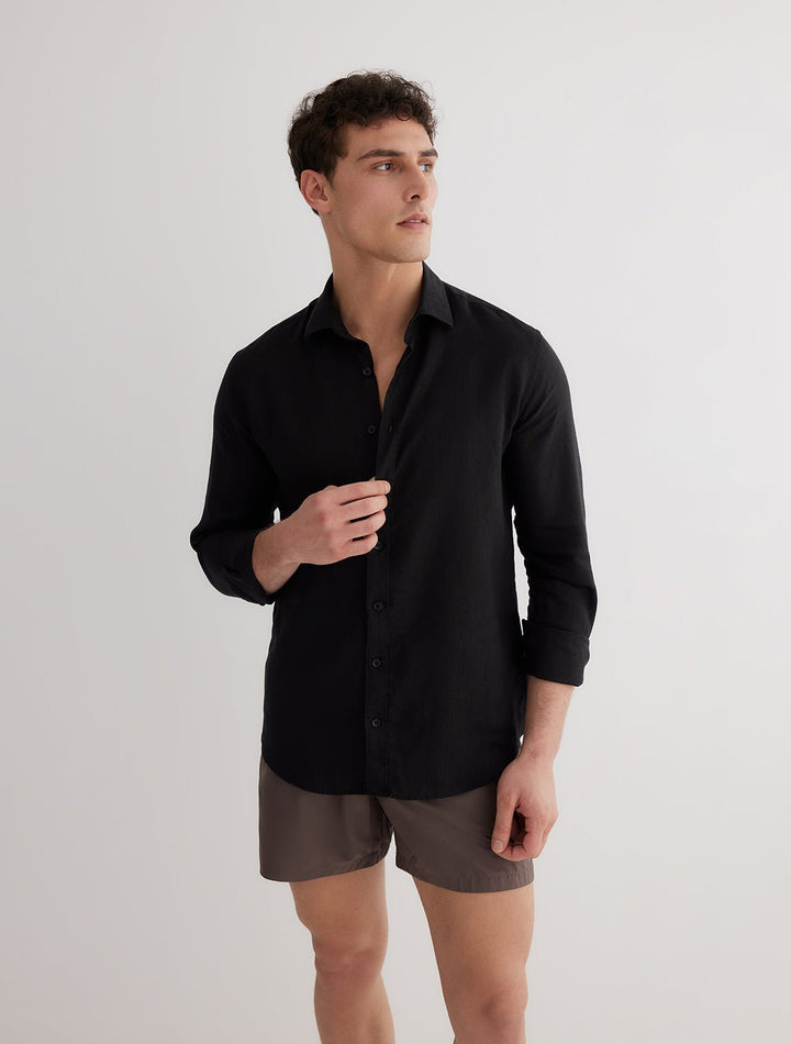 Front View: Model in James Black Shirt - MOEVA Luxury Swimwear, Spread Collar, Buttoned Cuffs, Button Fastening, Long-Sleeved, Slim Fit, MOEVA Luxury Swimwear