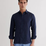 Front View: Model in James Dark Blue Shirt - MOEVA Luxury Swimwear, Spread Collar, Buttoned Cuffs, Button Fastening, Long-Sleeved, Slim Fit, MOEVA Luxury Swimwear